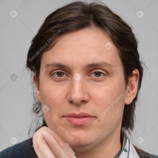 Joyful white adult female with medium  brown hair and grey eyes