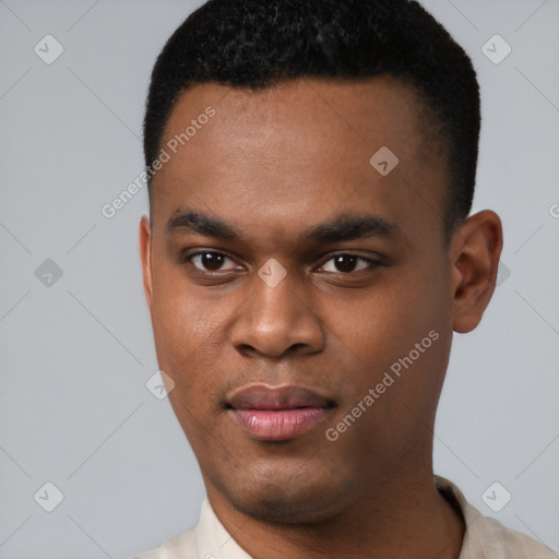 Joyful black young-adult male with short  black hair and brown eyes