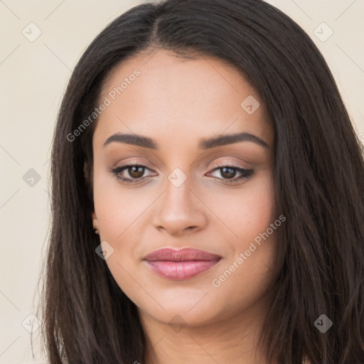 Joyful latino young-adult female with long  brown hair and brown eyes