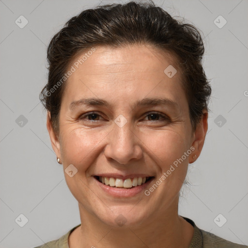 Joyful white adult female with short  brown hair and brown eyes