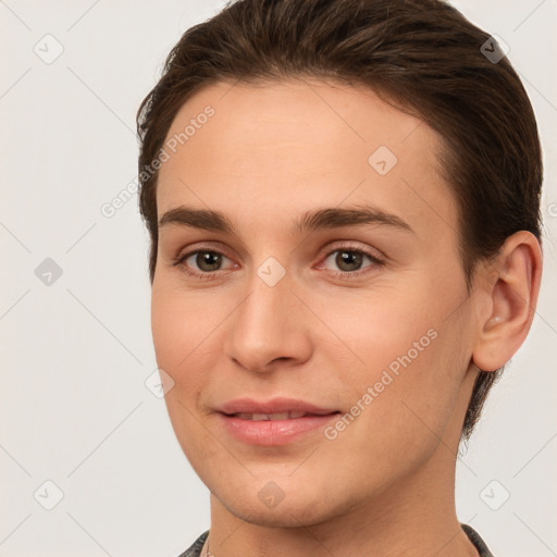 Joyful white young-adult female with short  brown hair and brown eyes