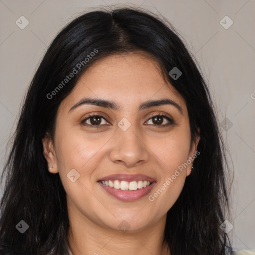 Joyful latino young-adult female with long  brown hair and brown eyes