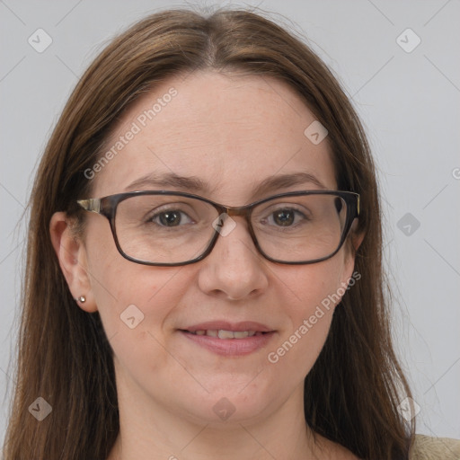 Joyful white adult female with long  brown hair and grey eyes