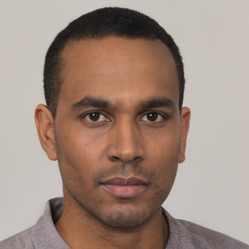 Neutral black young-adult male with short  black hair and brown eyes