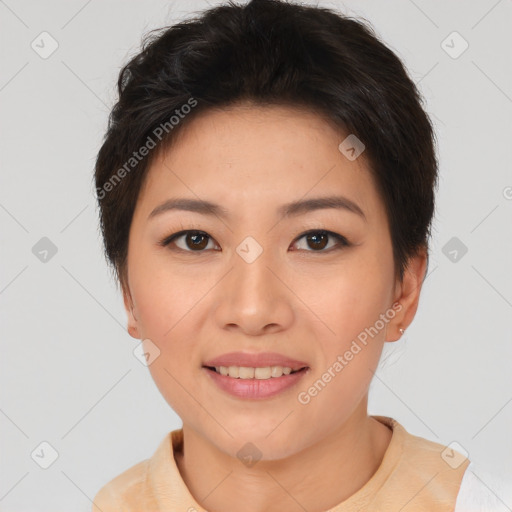 Joyful asian young-adult female with short  brown hair and brown eyes