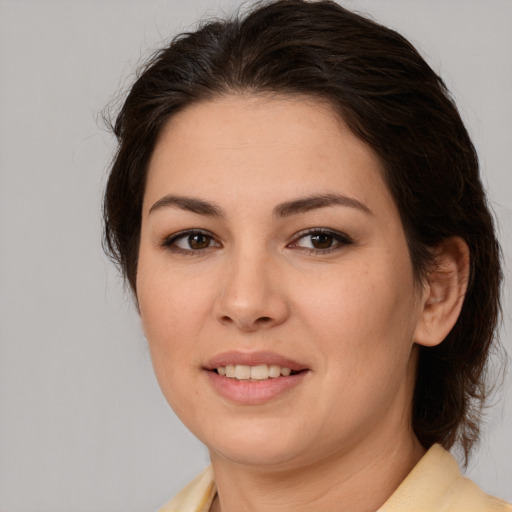 Joyful white young-adult female with medium  brown hair and brown eyes