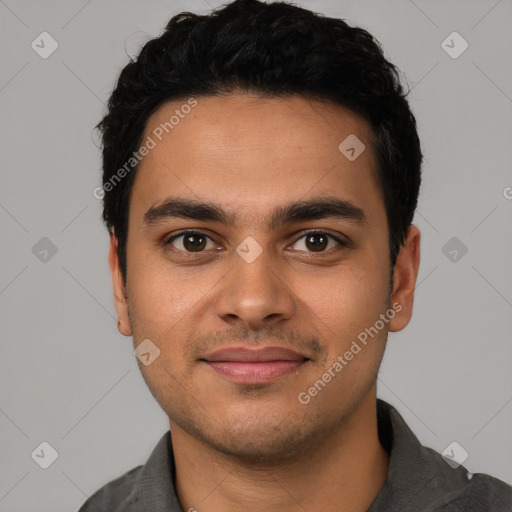 Joyful latino young-adult male with short  black hair and brown eyes