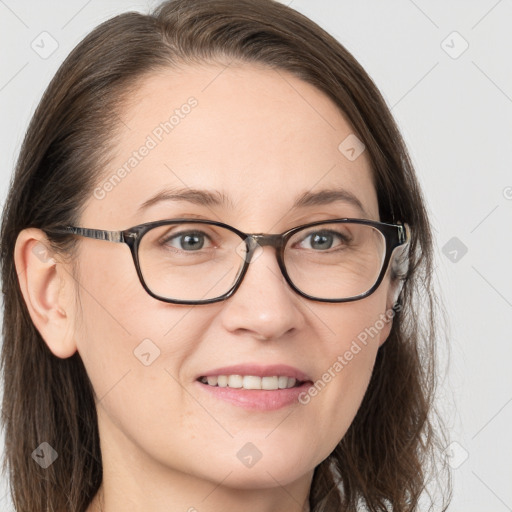 Joyful white young-adult female with long  brown hair and grey eyes