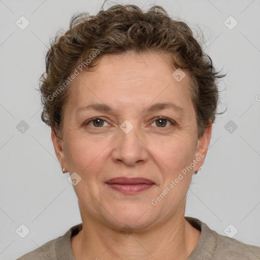 Joyful white adult female with short  brown hair and grey eyes