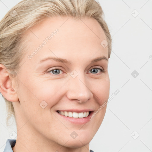 Joyful white young-adult female with medium  brown hair and blue eyes