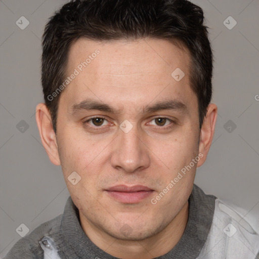 Joyful white adult male with short  brown hair and brown eyes