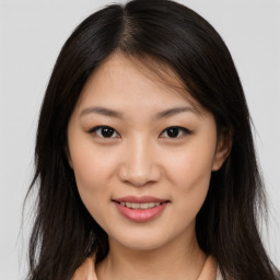 Joyful asian young-adult female with long  brown hair and brown eyes