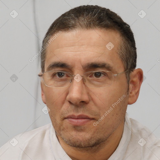 Joyful white adult male with short  brown hair and brown eyes