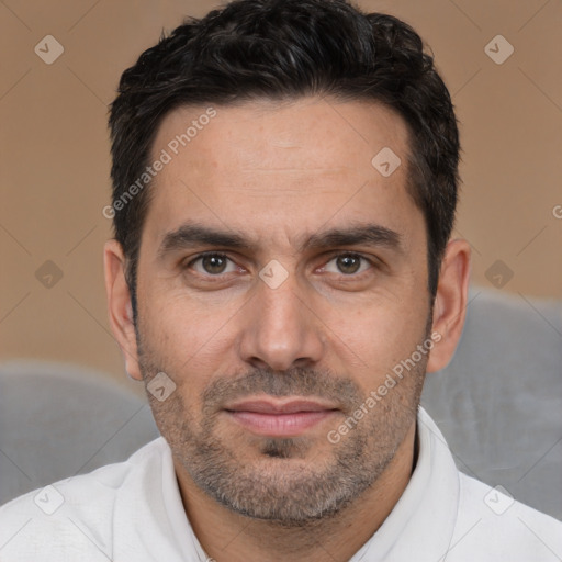 Joyful white adult male with short  black hair and brown eyes