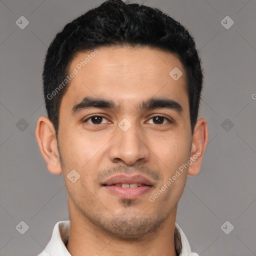 Joyful latino young-adult male with short  black hair and brown eyes