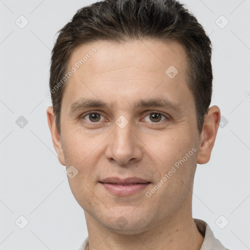 Joyful white adult male with short  brown hair and brown eyes