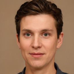 Joyful white adult male with short  brown hair and grey eyes