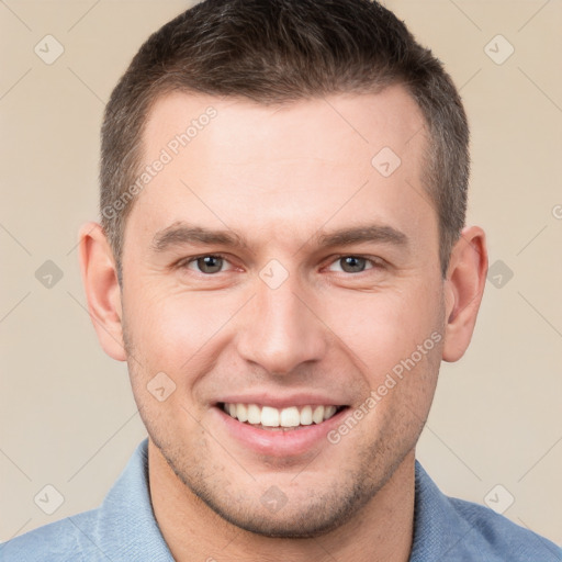 Joyful white young-adult male with short  brown hair and brown eyes