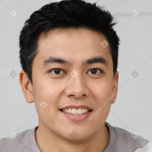 Joyful asian young-adult male with short  brown hair and brown eyes