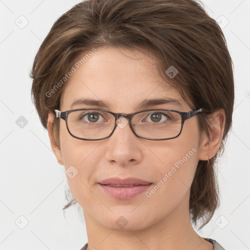 Joyful white young-adult female with medium  brown hair and grey eyes