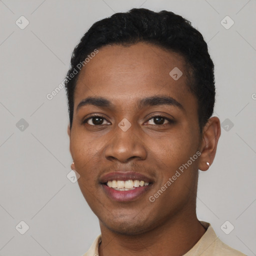 Joyful black young-adult male with short  black hair and brown eyes