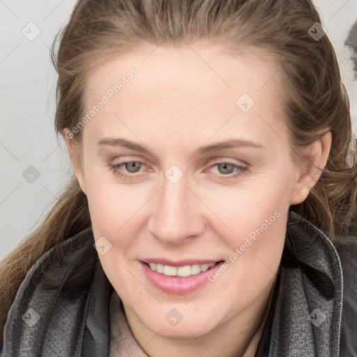 Joyful white young-adult female with medium  brown hair and grey eyes