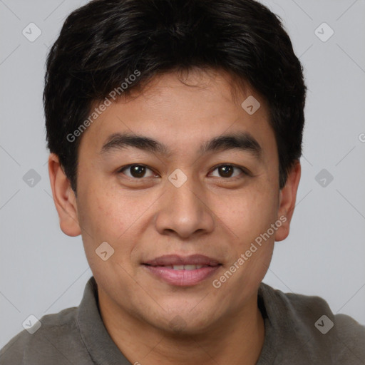 Joyful asian young-adult male with short  brown hair and brown eyes