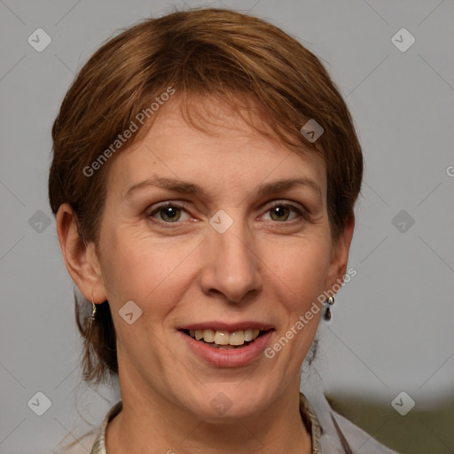 Joyful white adult female with medium  brown hair and grey eyes