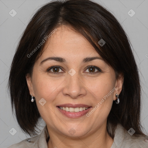 Joyful white adult female with medium  brown hair and brown eyes