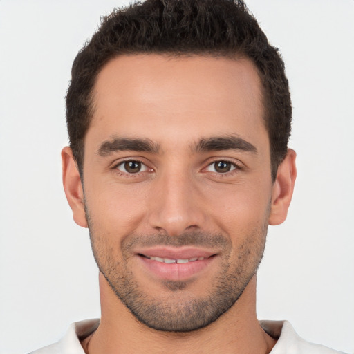 Joyful white young-adult male with short  brown hair and brown eyes