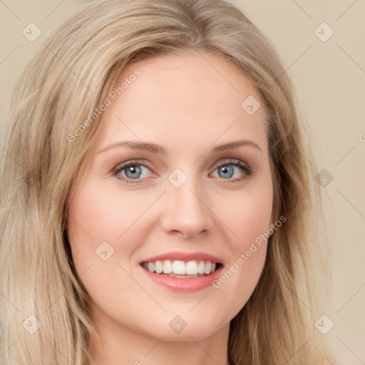 Joyful white young-adult female with long  brown hair and blue eyes