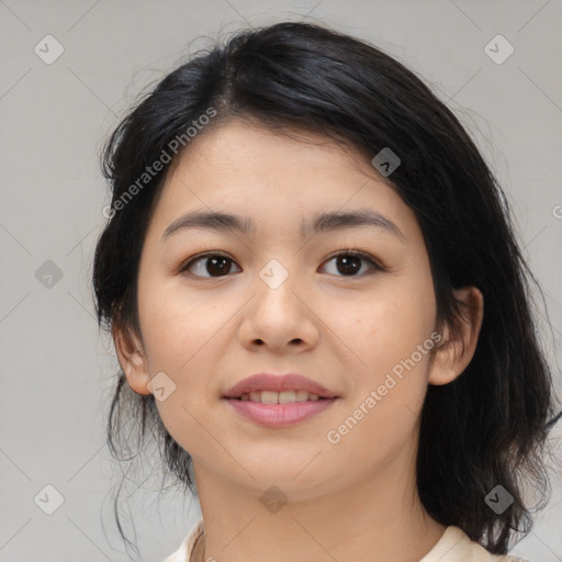 Joyful asian young-adult female with medium  black hair and brown eyes
