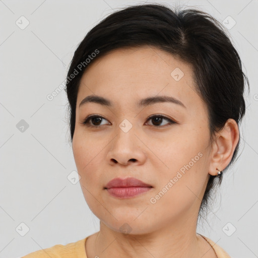 Joyful asian young-adult female with medium  brown hair and brown eyes