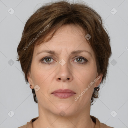 Joyful white adult female with short  brown hair and grey eyes