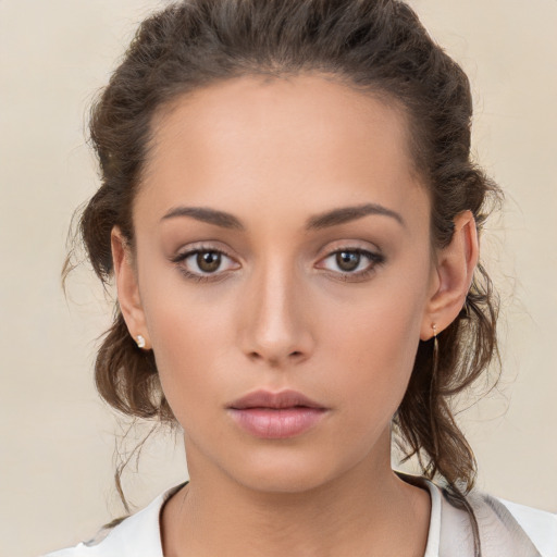 Neutral white young-adult female with medium  brown hair and brown eyes