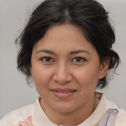 Joyful white adult female with medium  brown hair and brown eyes