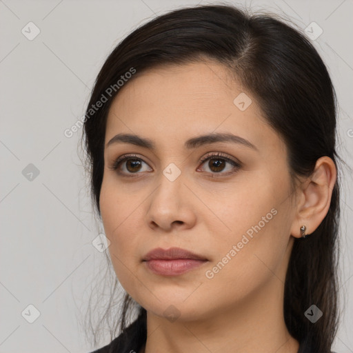 Joyful white young-adult female with long  brown hair and brown eyes