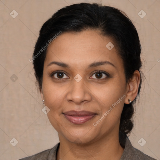 Joyful latino adult female with medium  brown hair and brown eyes