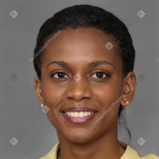 Joyful black young-adult female with short  brown hair and brown eyes