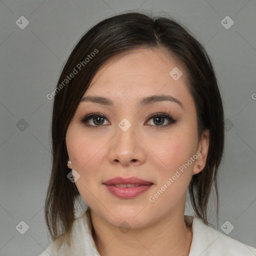 Joyful latino young-adult female with medium  brown hair and brown eyes
