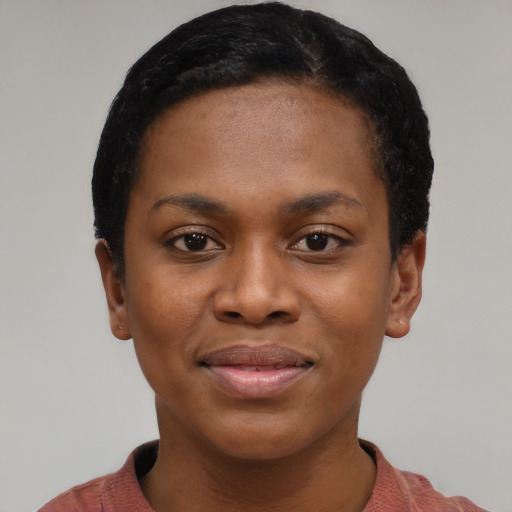 Joyful black young-adult female with short  black hair and brown eyes