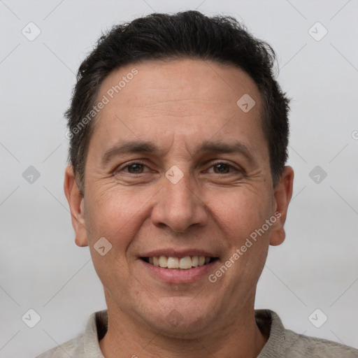 Joyful white adult male with short  brown hair and brown eyes