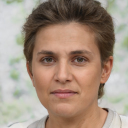 Joyful white adult female with short  brown hair and brown eyes