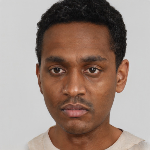 Neutral black young-adult male with short  black hair and brown eyes