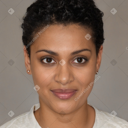 Joyful black young-adult female with short  brown hair and brown eyes