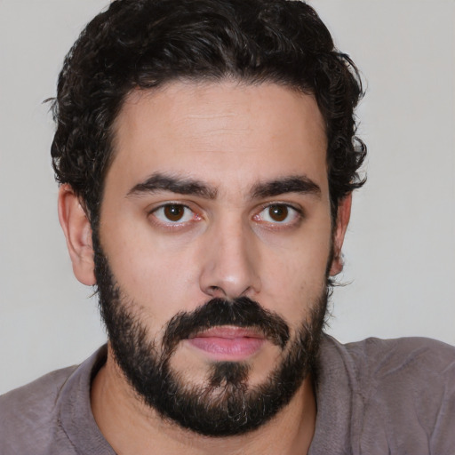 Neutral white young-adult male with short  black hair and brown eyes