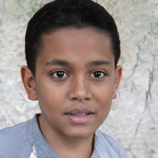 Joyful white child male with short  brown hair and brown eyes