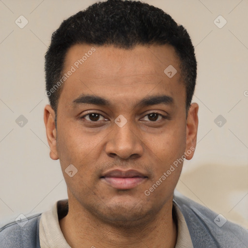 Joyful latino young-adult male with short  black hair and brown eyes