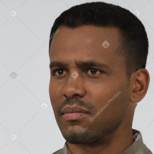 Neutral latino young-adult male with short  black hair and brown eyes