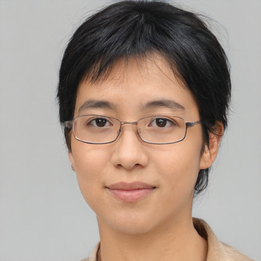 Joyful asian young-adult female with medium  black hair and brown eyes